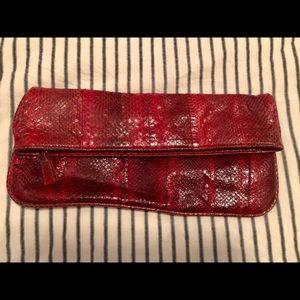 Britney snake skin clutch